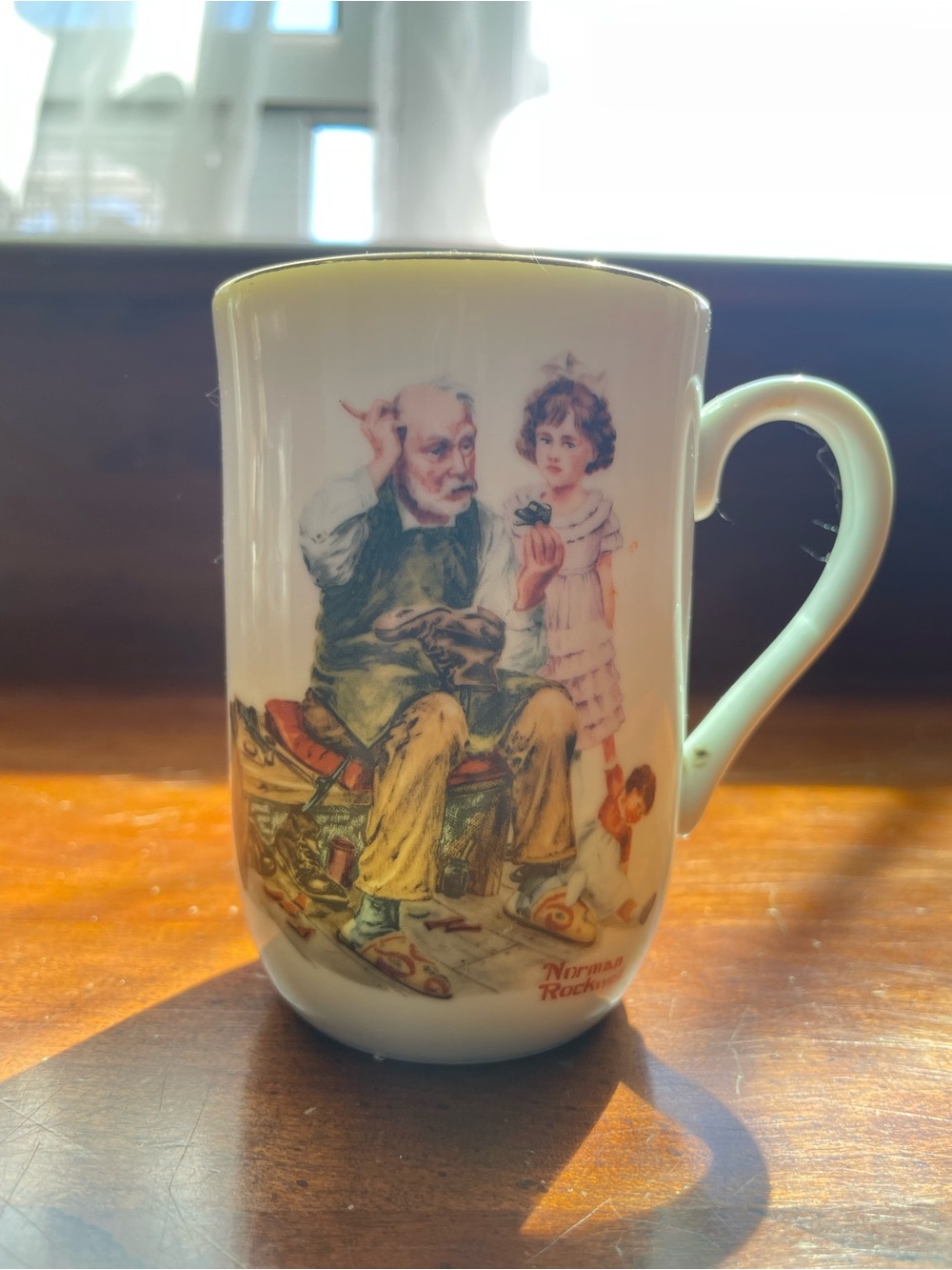 Norman Rockwell Cream and Blue “The Cobbler” Collector Mug Base Stamp